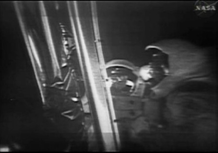 This photo, from NASA TV, shows the Apollo 11 astronauts on the lunar surface after landing from a new digitally refurbished version of the original moon landing video unveiled in Washington Thursday, July 16, 2009. After NASA couldn't find its original videotapes, NASA and a Hollywood film restoration company took television video copies of what Apollo 11 beamed to Earth on July 20, 1969, and made the pictures look sharper.